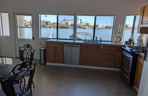 Discovery Bay House | Over the water experience in Biggest Bay/w Water Toys, Beach nearby. Waterfront