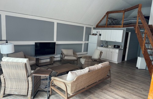East Jordan House | Overlooks the Marina in East Jordan’s South Arm. Located next door to MOM’s Bar
