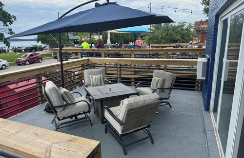 East Jordan House | Overlooks the Marina in East Jordan’s South Arm. Located next door to MOM’s Bar