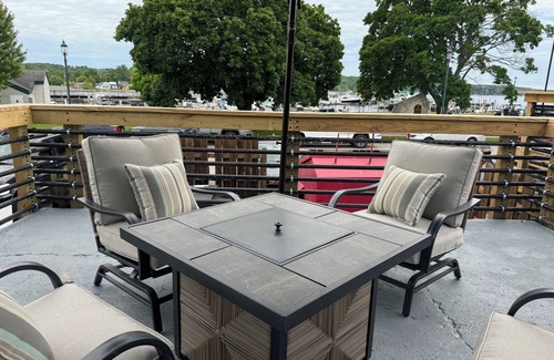 East Jordan House | Overlooks the Marina in East Jordan’s South Arm. Located next door to MOM’s Bar