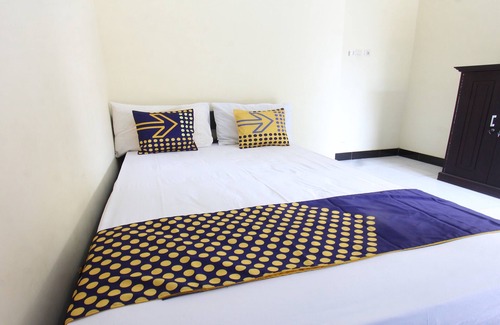 Muncan Hotel | OYO Life 93155 Wisma Sarah