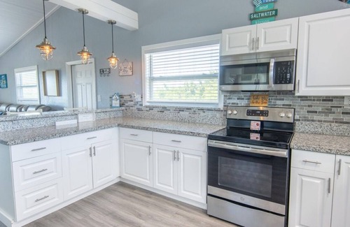 Port Pine Heights House | PADGETT PARADISE with Two Boat Slips with Filet Table. POOL