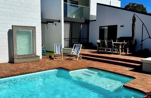 Golden Square House | Palm Springs Resort Style Spacious living + Pool & Indoor Wood Fire Place!