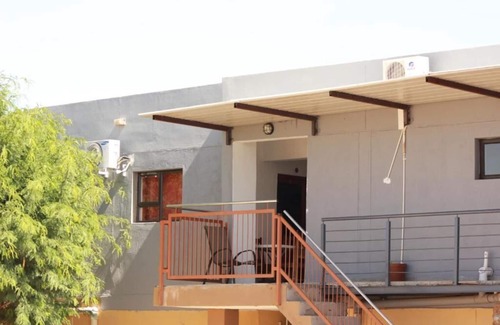 Windhoek House | Pandeinge - Family Room with Bathroom