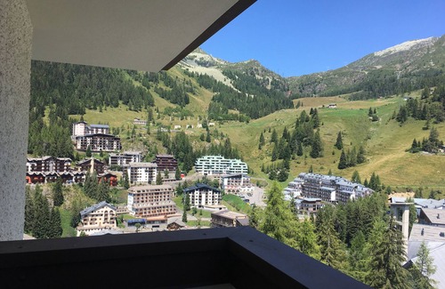 Foppolo Apartment | Panorama of Foppolo, the mountains and the slopes in the morning sun