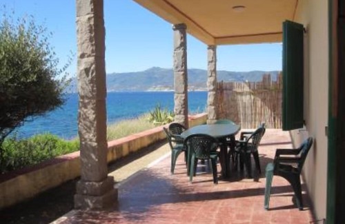 Porto Alabe Villa | Panoramic sea front housewith garden and beach directly below