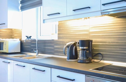 Agios Stefanos Apartment | Paola House: Modernly designed property for 6, centrally in Saint Stefanos