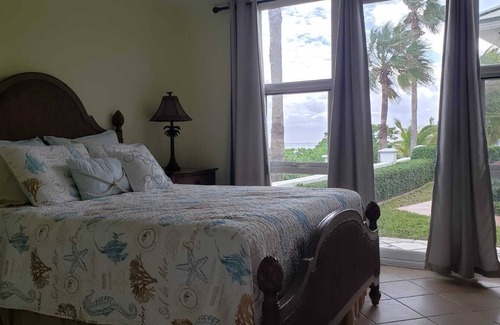Freeport House | Paradise is Due South! One level main house and 2 story complete guest house.