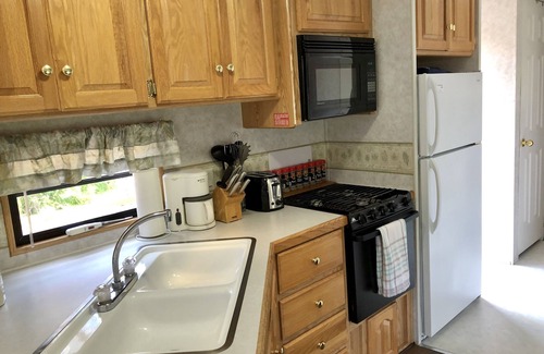 Garden Bay House | Park Model RV Glamping in Private Campground