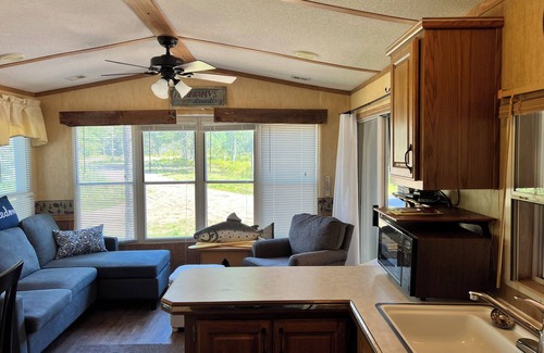 Boulder Junction Cabin | Parkmodel cabin w screened porch in campground on bike trail.