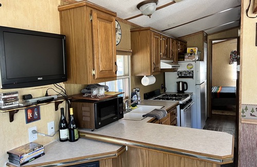 Boulder Junction Cabin | Parkmodel cabin w screened porch in campground on bike trail.