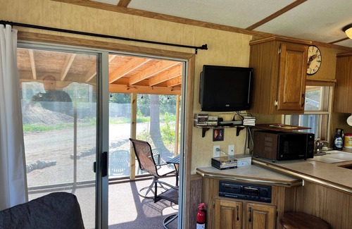 Boulder Junction Cabin | Parkmodel cabin w screened porch in campground on bike trail.