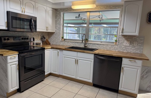 Port Charlotte House | Paws and poolside retreat: Cozy 2-bed, 2-bath, Salt Water Heated Pool