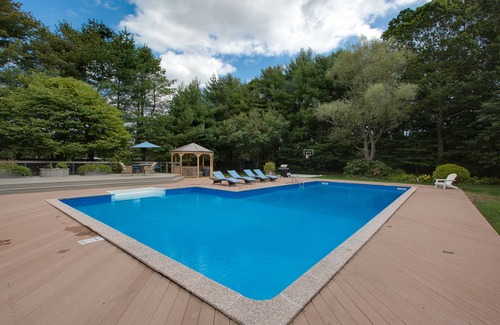 Shirley House | Peaceful Beach Retreat - Heated Pool, Big Backyard, Mini-Bar & Game Room