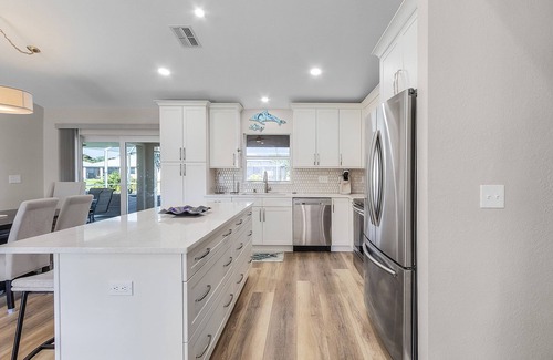 Trafalgar House | Peaceful fresh water canal home with heated pool. Incredible Value.