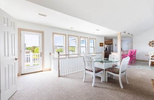 Southern Shores House | Peaceful lakefront views with private saltwater pool, large scale living, and wonderful amenities
