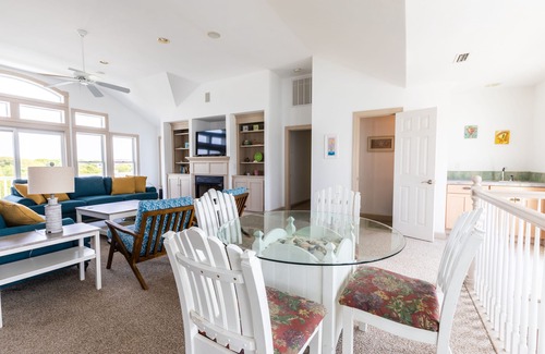 Southern Shores House | Peaceful lakefront views with private saltwater pool, large scale living, and wonderful amenities