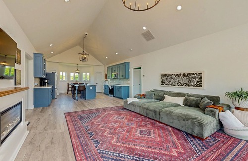 Orange House | Peaceful retreat with hot tub, fire pit, games, kayaks, and water view