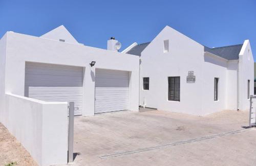 Langebaan House | Pelican Cove is a Modern 4-Bedroom Holiday Home in Langebaan with some Sea Views
