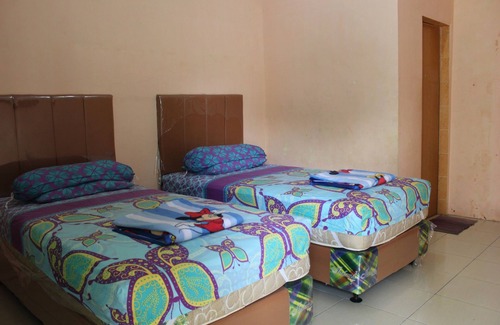 Medan House | Penginapan Transit Tomato