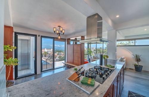 Colonia 5 de Diciembre Condo | Penthouse Condo with Private Rooftop Terrace. Short walk to the Beach & Malecón.