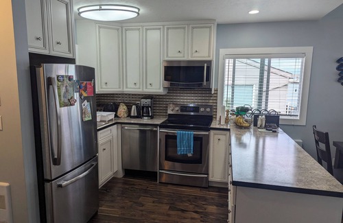 Adventure Bay Condo | Penthouse Condo with amazing OK lake and mountain views, private beach and dock.