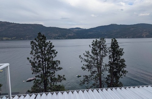 Adventure Bay Condo | Penthouse Condo with amazing OK lake and mountain views, private beach and dock.