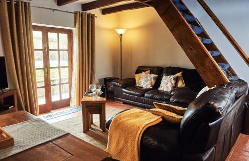 Llanybri House | Penuwch Boathouse- Lakeside rural cottage ideal for families with indoor heated pool
