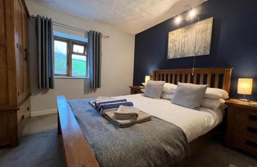 Llanybri House | Penuwch Boathouse- Lakeside rural cottage ideal for families with indoor heated pool