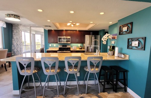 Vanderbilt Beach Condo | Perfect Location! On The Bay Direct View of Gulf! Wrap Around Lanai!