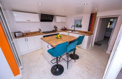 Port Talbot House | Pet-friendly accommodation with fenced garden 2 bedrooms, Secure bike shed .Cozy log burner Netflix