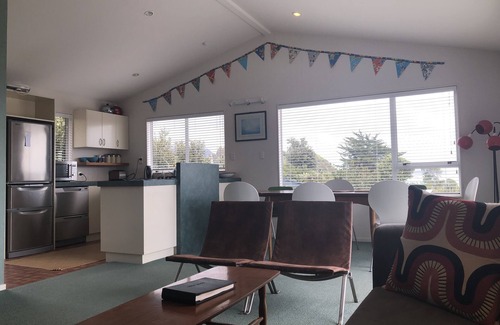 Tata Beach House | Pet friendly yard, great Sea Views and just across the road from Tata Beach