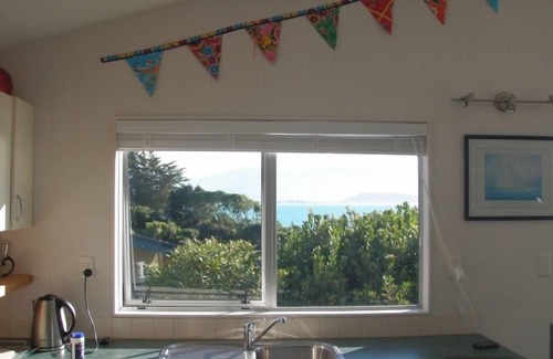 Tata Beach House | Pet friendly yard, great Sea Views and just across the road from Tata Beach