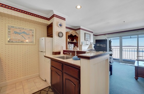 Boyne City Condo | Picture-Perfect Balcony View of Lake Charlevoix | Fireplace | Beach Access |