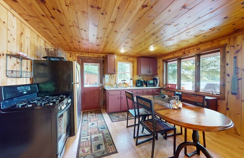 Presque Isle Cabin | Picturesque waterfront cabin w/a deck, firepit, & recreational pier
