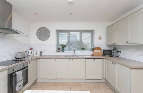 Rhoscolyn House | PINE CONES, with a garden in Four Mile Bridge