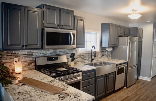 Plainwell House | Pine Lake Retreat- sparkling hot tub! Lakeside house with sandy beach lakefront!