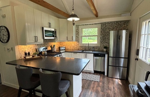 Hessel Cottage | Pine River Cottage -Savor the Summer by the River – A Waterfront Paradise!