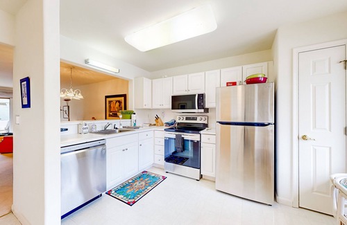 Lewes House | Plantations East dog-friendly townhouse with fireplace & water view
