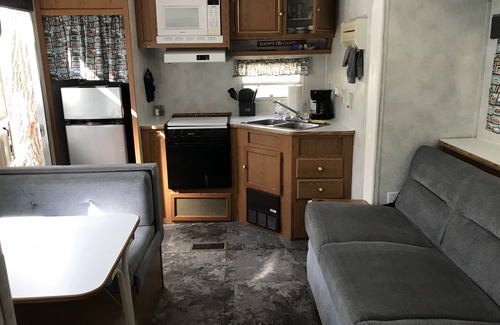 Benzonia House | Platte - RV Camper in the Woods with Fire pit & Hot Tub Access