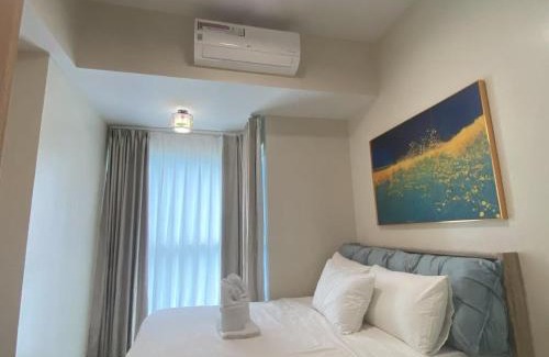 Tambo Apartment | Playful 1BR With Magnificant Bayview Garden View Near Okada Solaire Aiports with Free Parking