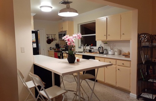 Lake Worth Corridor House | Plumaria Room with private bathroom on shared lakeview House