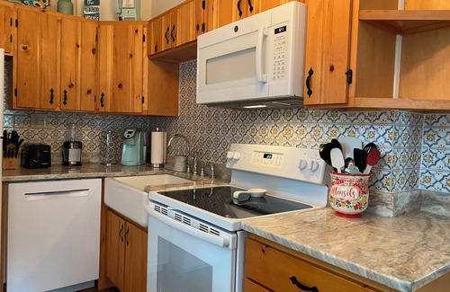 Penn Lake Park House | Pocono Lakefront Home- with Private Dock & Swim Raft, Fire Pit, & Boats!