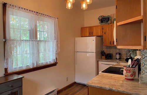 Penn Lake Park House | Pocono Lakefront Home- with Private Dock & Swim Raft, Fire Pit, & Boats!
