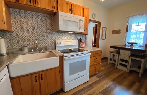 Penn Lake Park House | Pocono Lakefront Home- with Private Dock & Swim Raft, Fire Pit, & Boats!