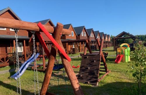 Wicie Resort | Pod Dębami Wicie- domki drewniane nad morzem
