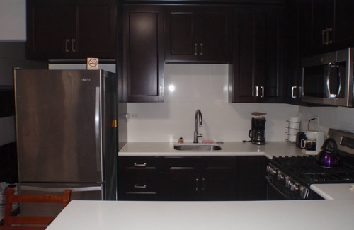 Kamay House | Pool, 2 full Kitchens 3 kings, 1 Queen, 5 twin beds.Close to Palm Beach plaza.