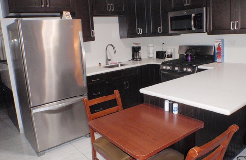 Kamay House | Pool, 2 full Kitchens 3 kings, 1 Queen, 5 twin beds.Close to Palm Beach plaza.