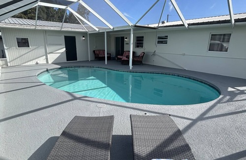 Taylor Creek House | Pool house with lake access