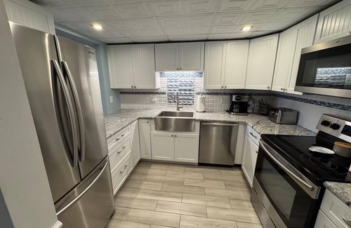 North Beach Haven Condo | Pool. Smart TV. WiFi. Beach Badges. Beach Chairs Patio.O/S. W/D. 140155